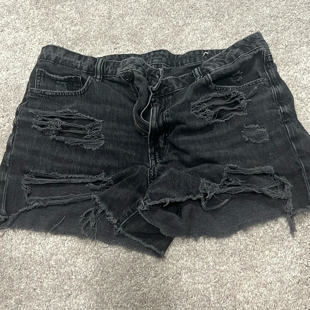 Black ripped shorts with side button